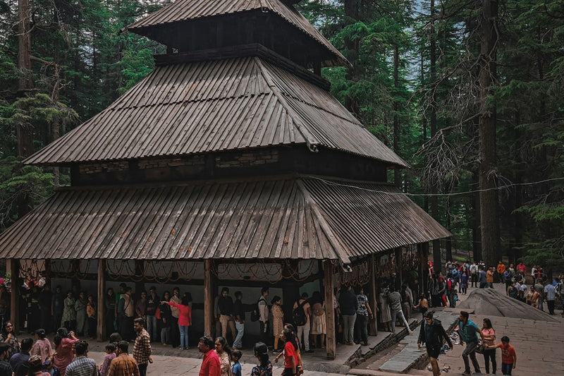 The wooden Hadimba Devi temple among tall cedar trees in Manali