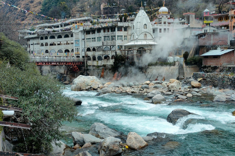 Manikaran gurdwara beside the Parvati river with steam rising from the hot springs