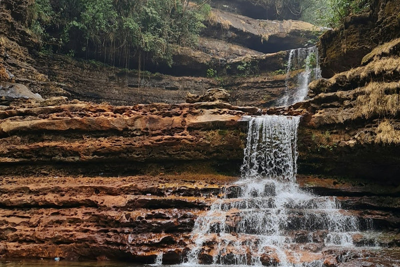 Wei Sawdong falls stepping down three tiers of layered rock into pools